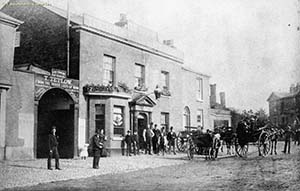 'From the three legs of man', black and white photo, men with horse and cart.