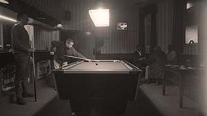 Men playing pool in a pub