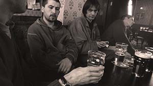 Men drinking in a pub